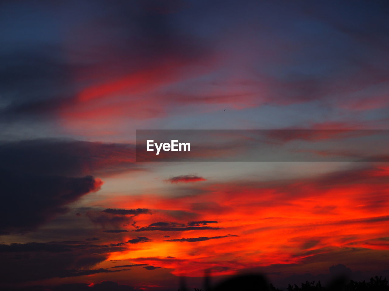 Low angle view of dramatic sky during sunset