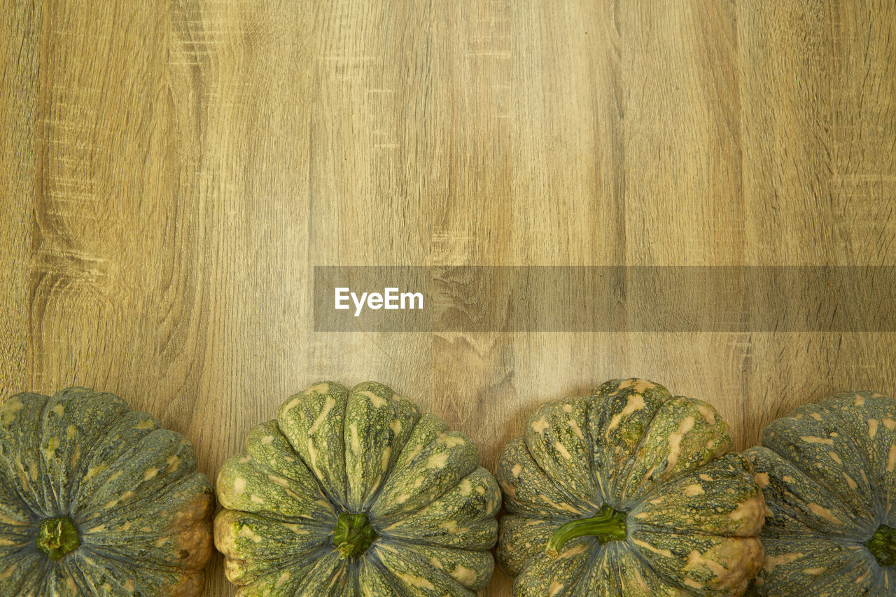 Close-up of gourds on wooden table