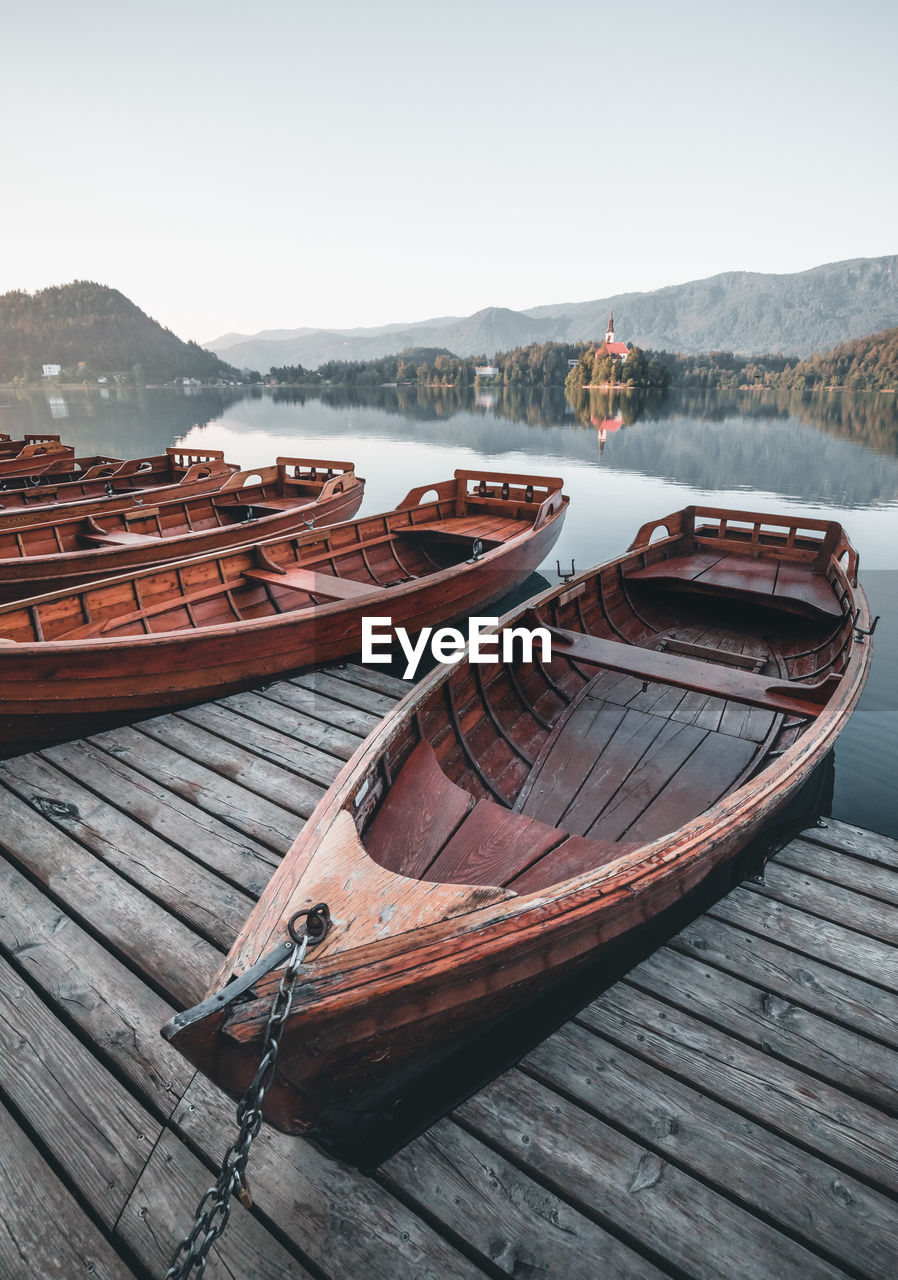 Boats moored on lake