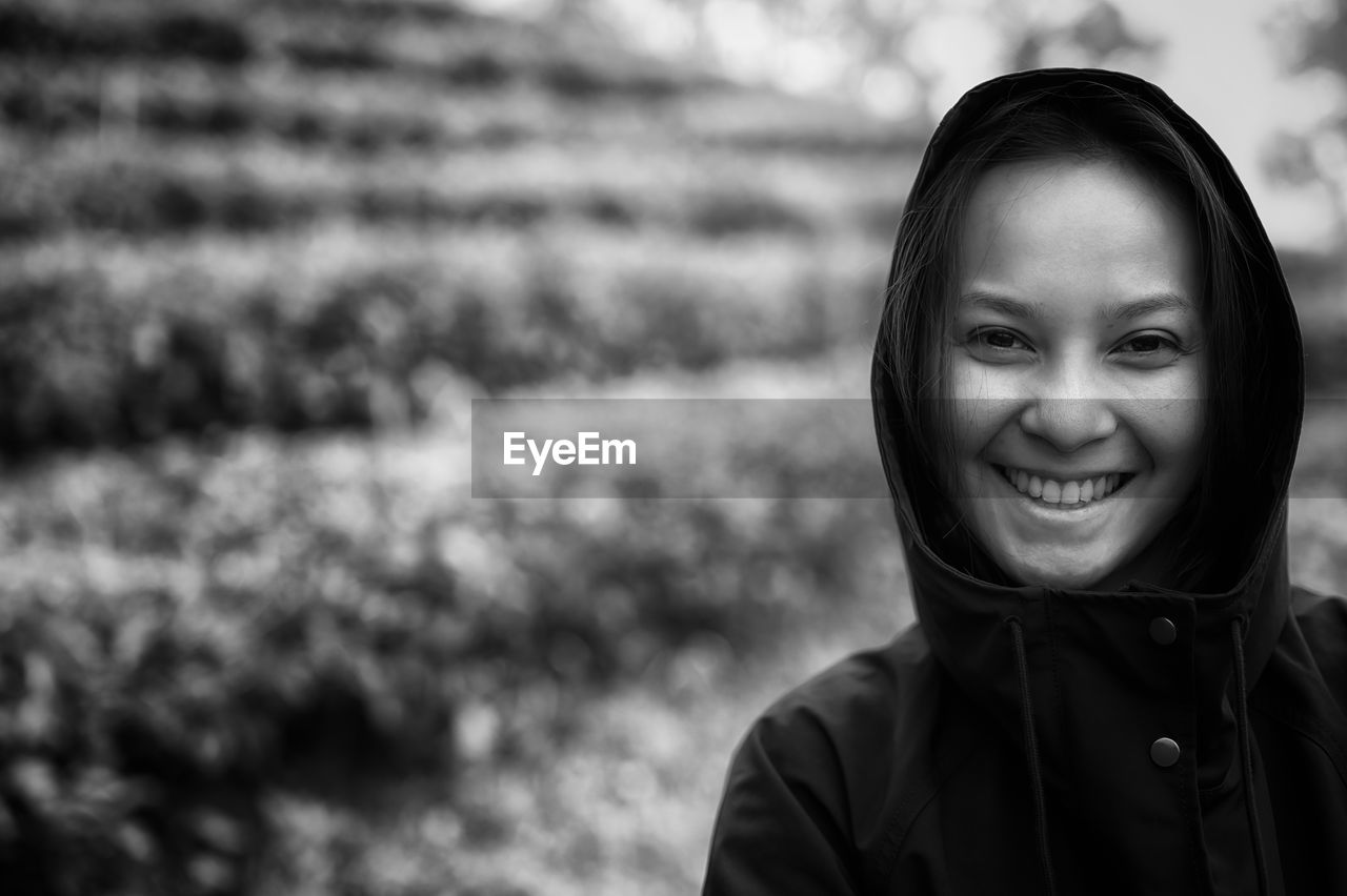 Black and white film style , close up young women weraing hoodie with beautiful smile