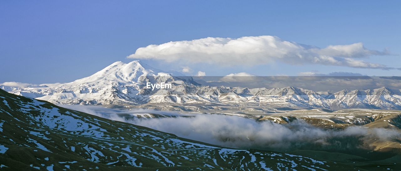 Scenic view of snowcapped mountains against sky