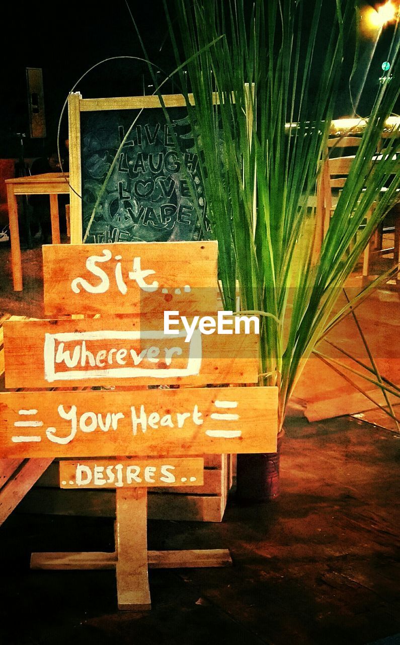 Wooden sign in sidewalk cafe