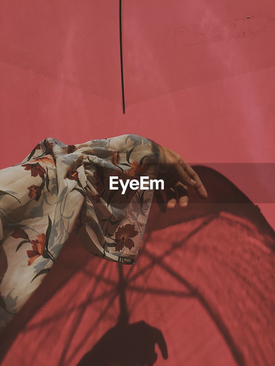 Close-up of woman holding red umbrella