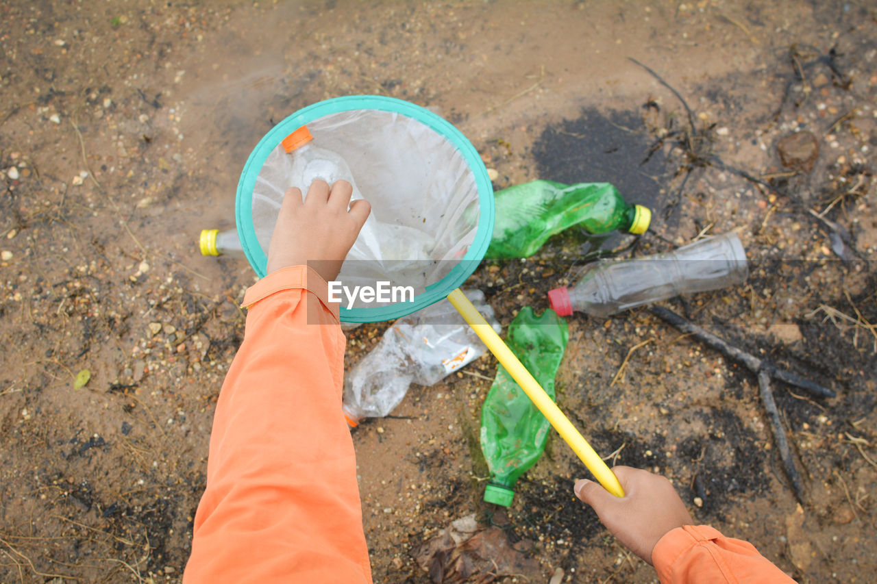 Volunteers cleaning lakeshore at forest