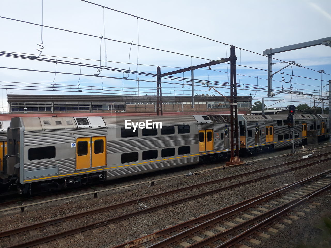 Train on railroad tracks against sky. this is sydney train service of australia.