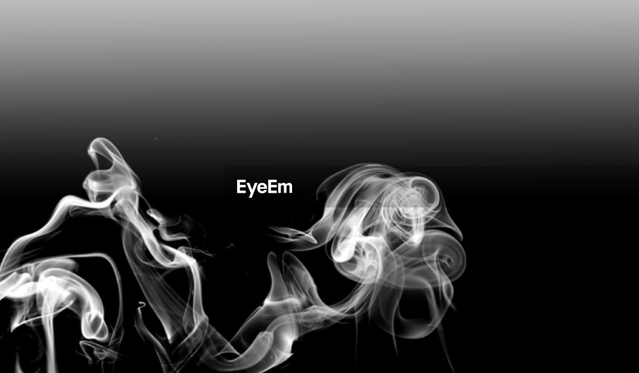 Close-up of smoke against black background