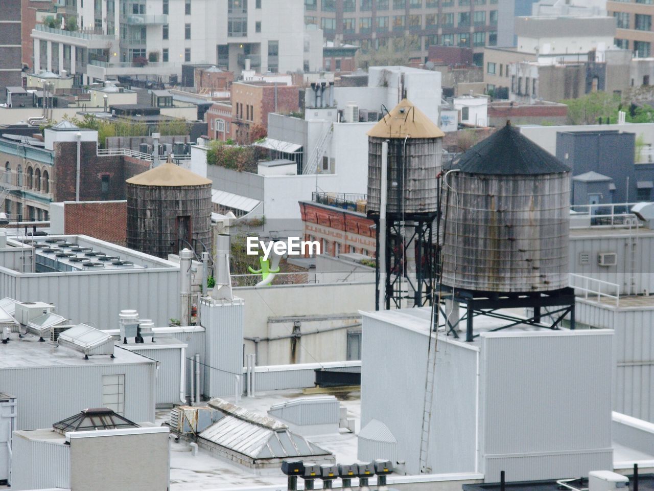 High angle view of water tanks on roof in city