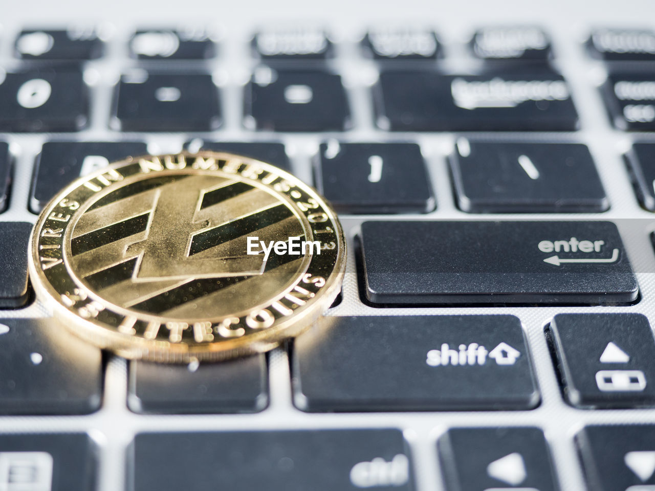 Close-up of bitcoin on computer keyboard