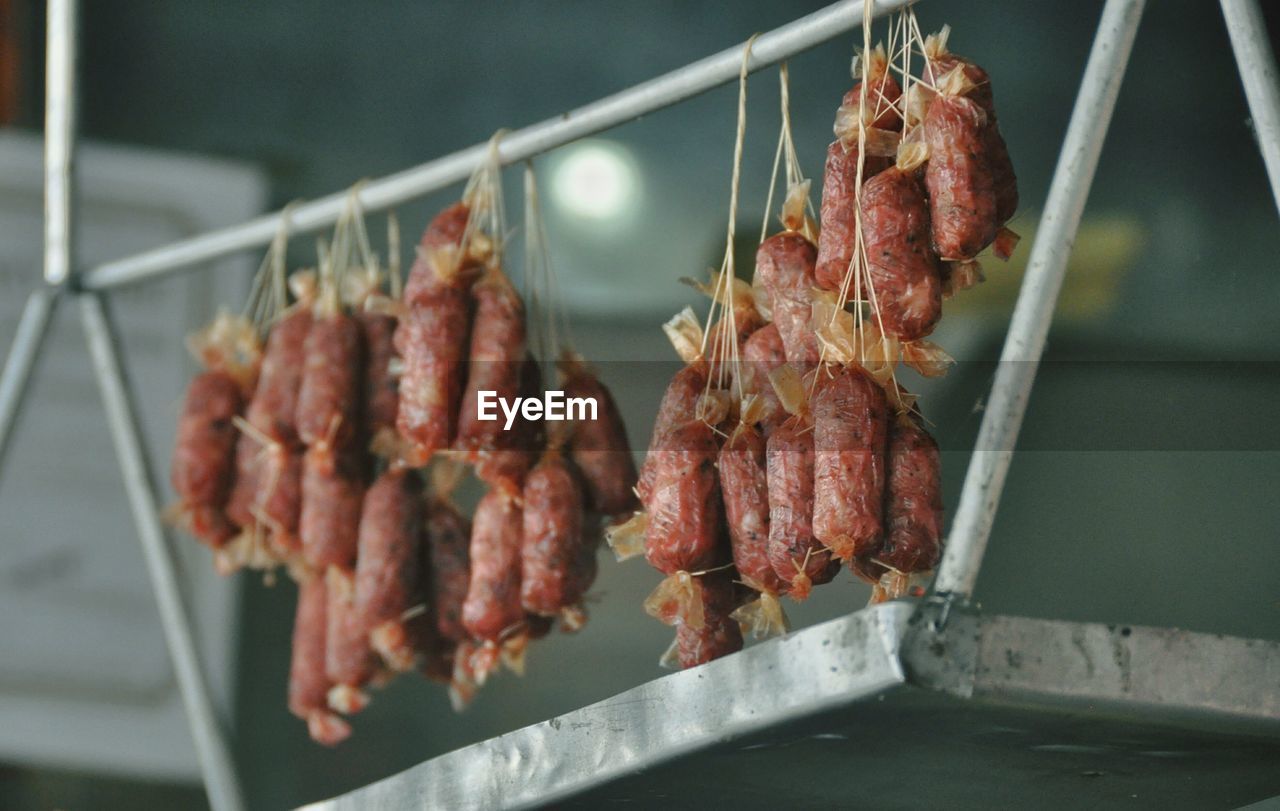 Close-up of meat hanging on rack