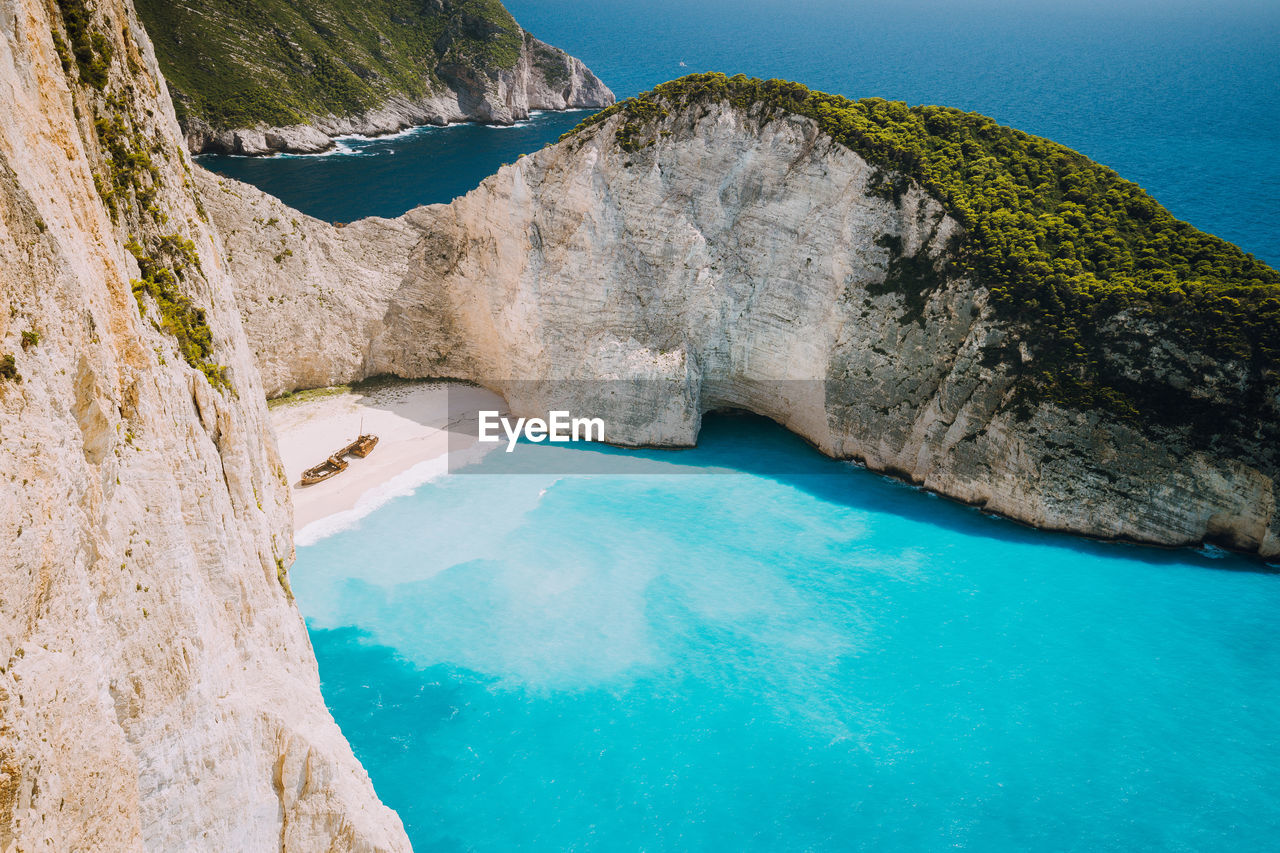 SCENIC VIEW OF SEA SEEN THROUGH ROCK