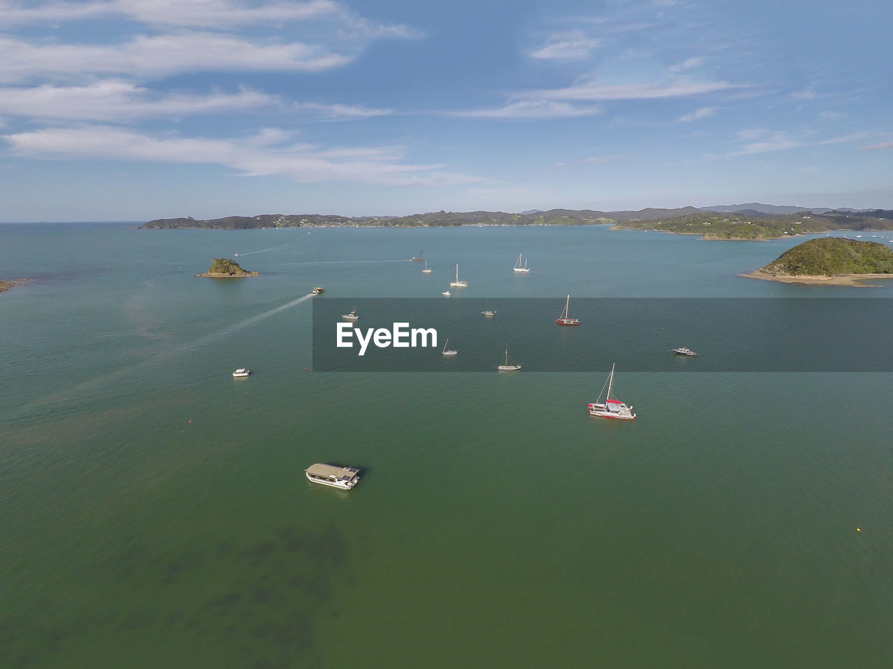 High angle view of boats sailing in sea against sky