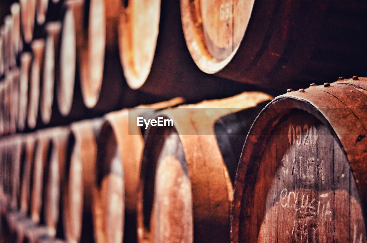 Wooden wine casks arranged in cellar