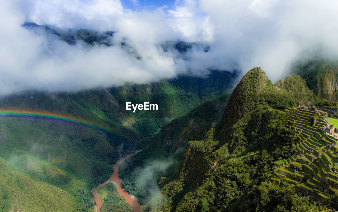 Scenic view of clouds covering mountains