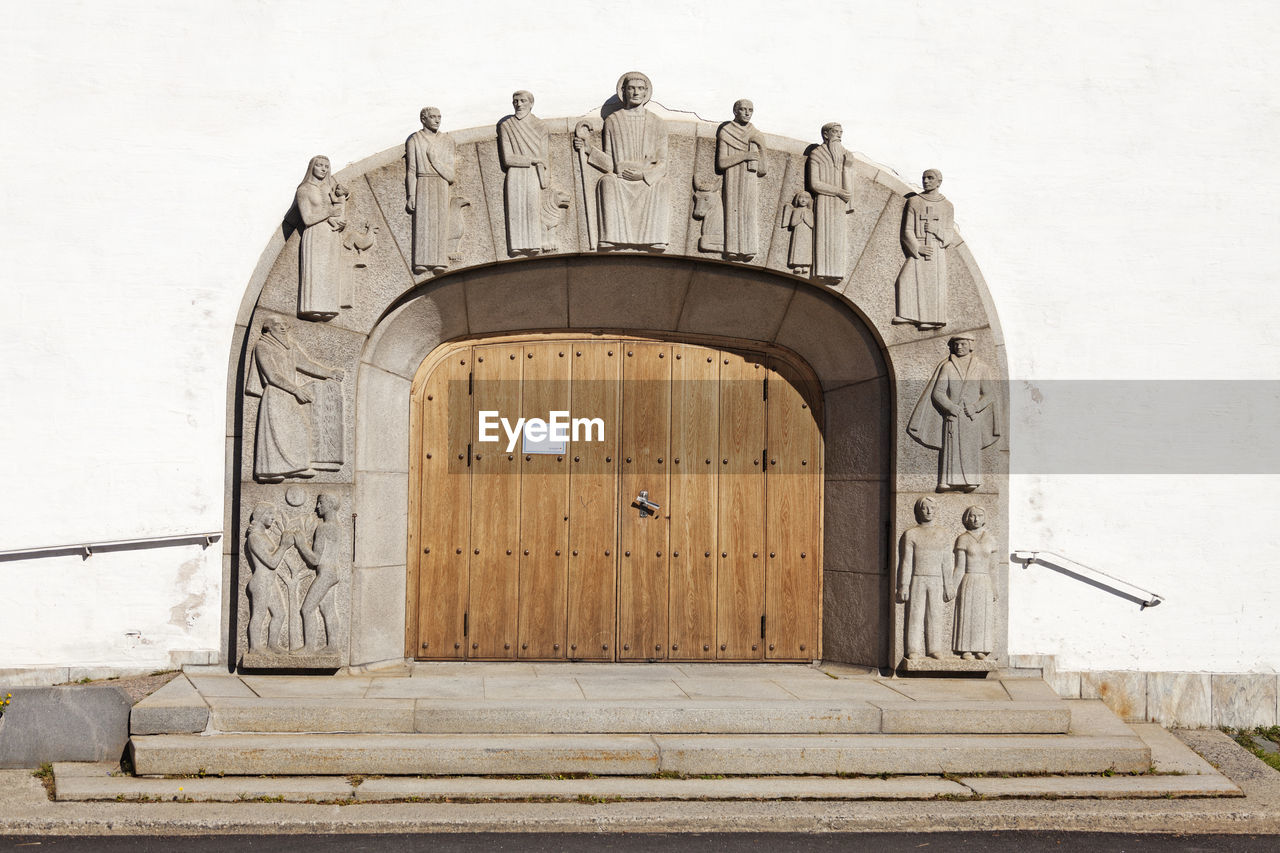 Church gate with interesting stone figures in relief