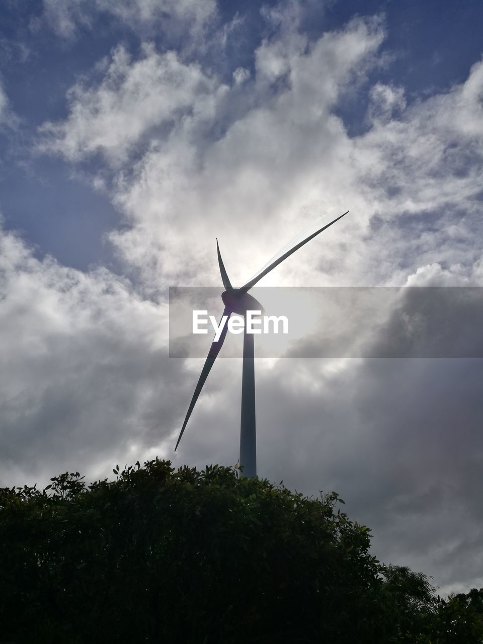 LOW ANGLE VIEW OF SILHOUETTE WIND TURBINE AGAINST SKY