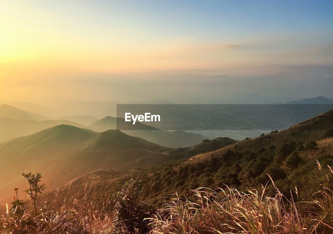 Scenic view of landscape against sky during sunset