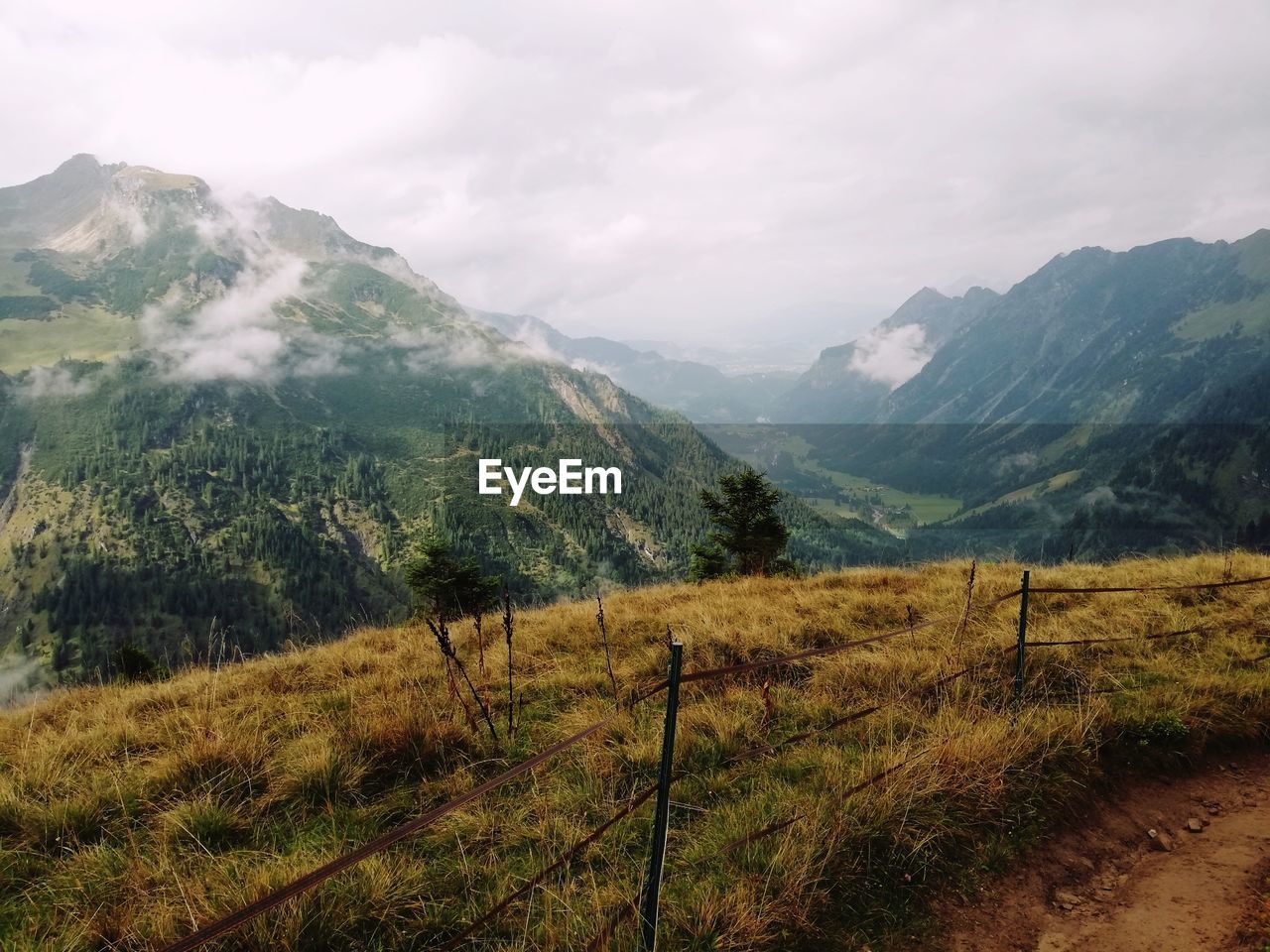 Scenic view of landscape and mountains against sky