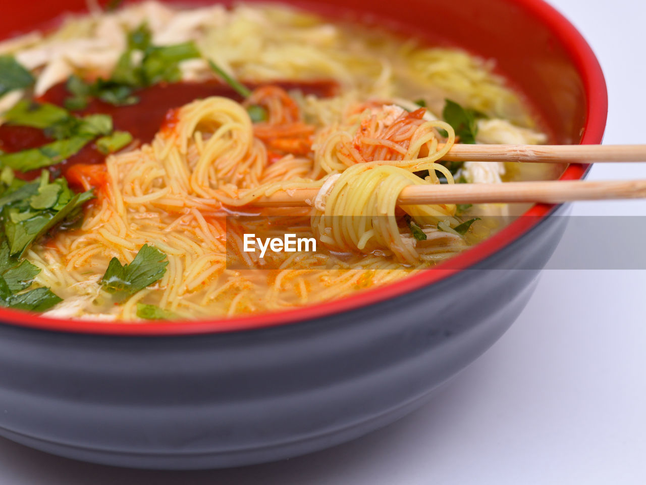 CLOSE-UP OF SOUP WITH NOODLES