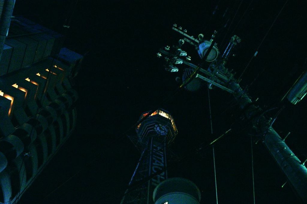 LOW ANGLE VIEW OF ILLUMINATED LIGHTS AT NIGHT