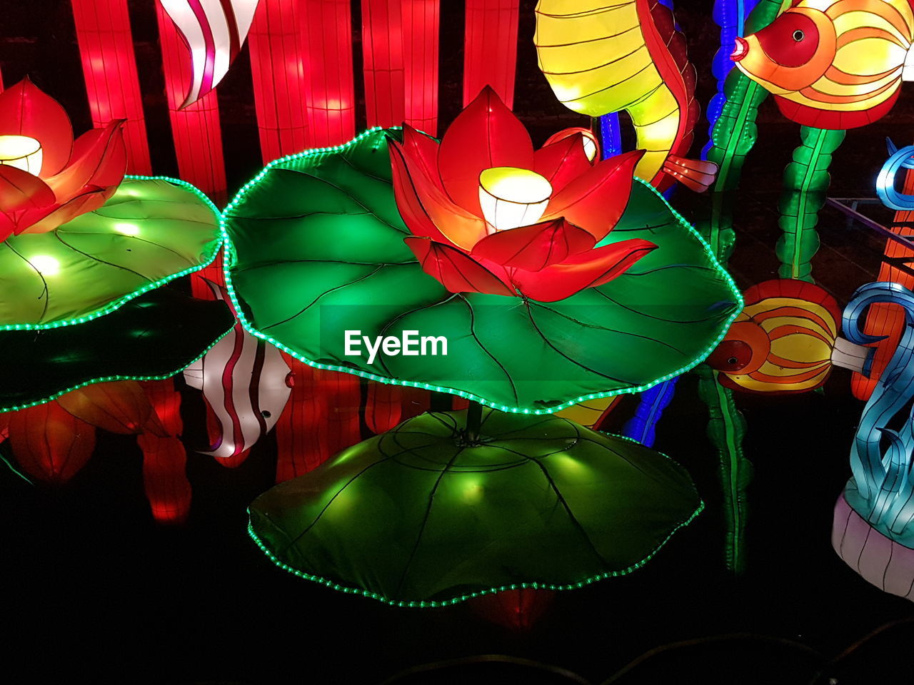 HIGH ANGLE VIEW OF ILLUMINATED DECORATIONS IN MARKET