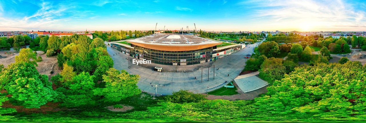 architecture, built structure, plant, nature, sky, panoramic, environment, landscape, travel, travel destinations, building exterior, history, the past, building, scenics - nature, cloud, city, landmark, tree, religion, land, sunset, beauty in nature, ancient, tourism, outdoors, blue, mansion, arts culture and entertainment, green, no people, tradition, high angle view, sport venue, temple - building, belief, multi colored, palace