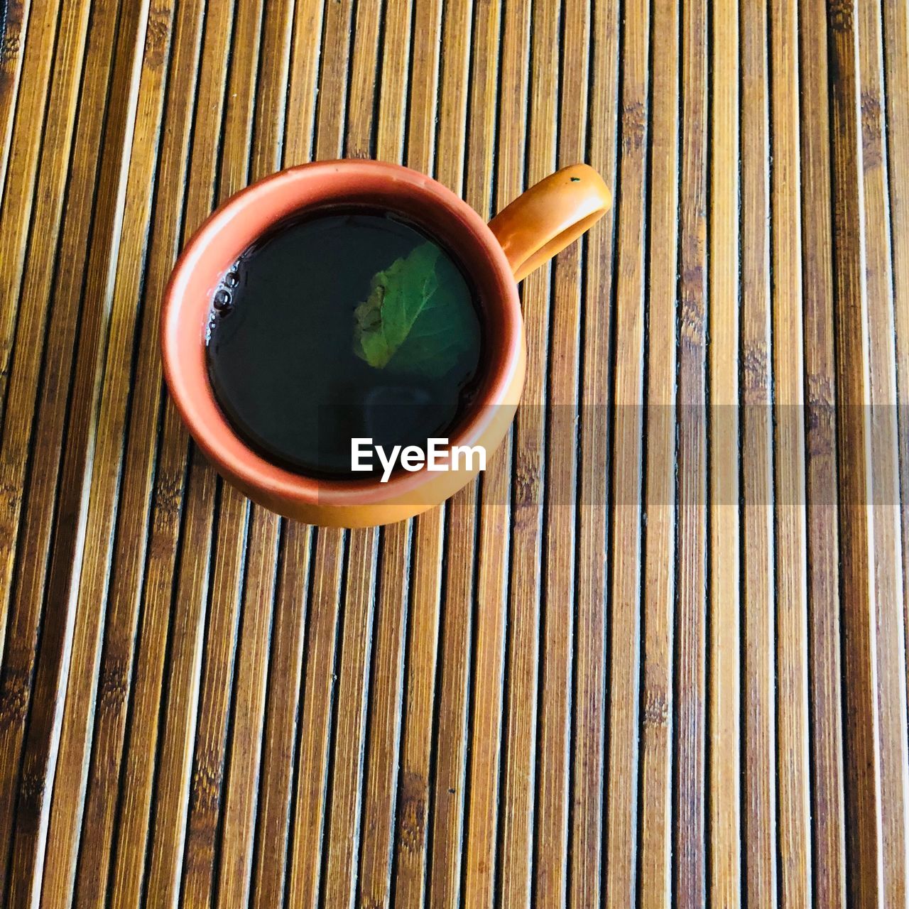 High angle view of tea cup on wooden table