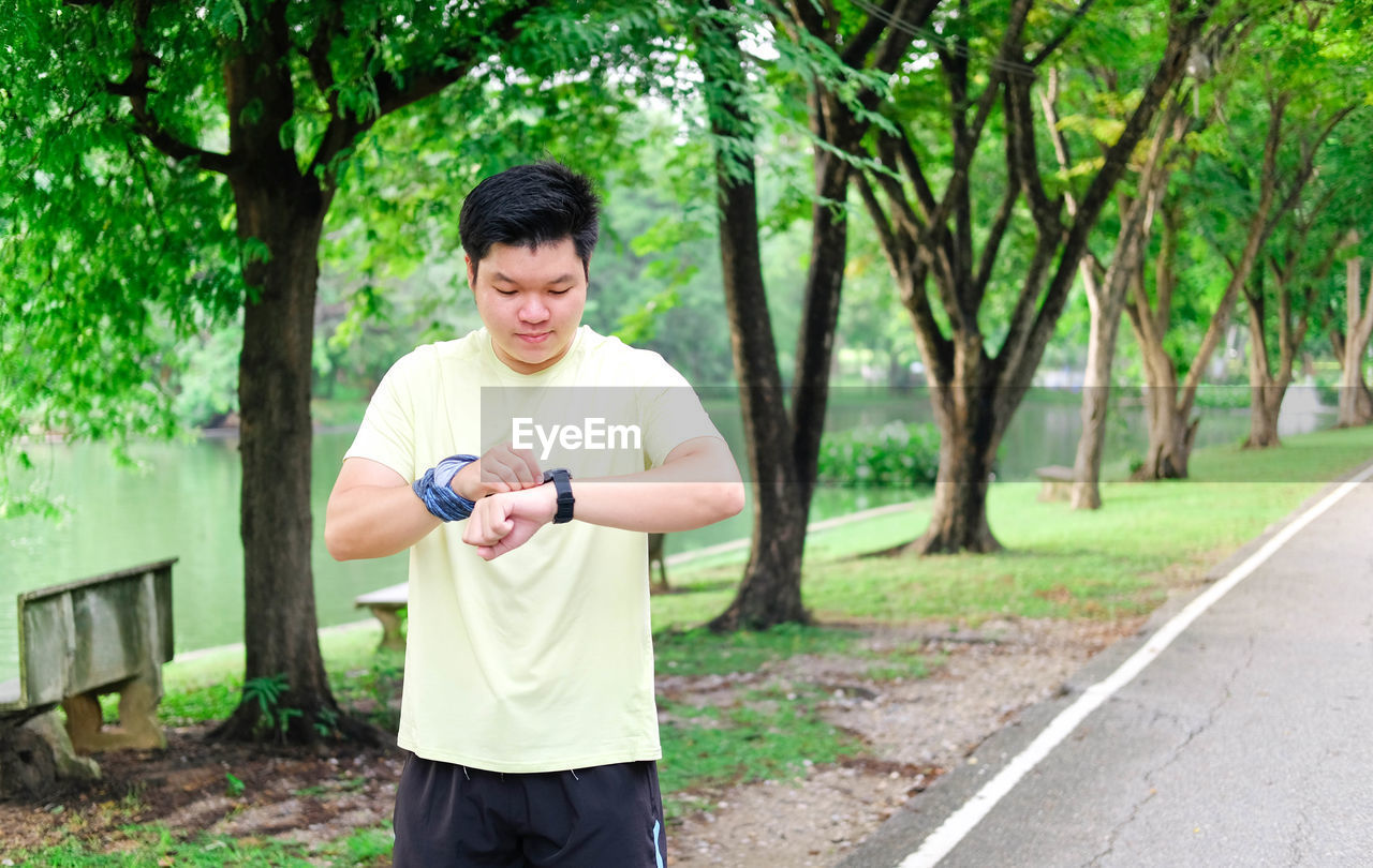 Side view of man exercising in park
