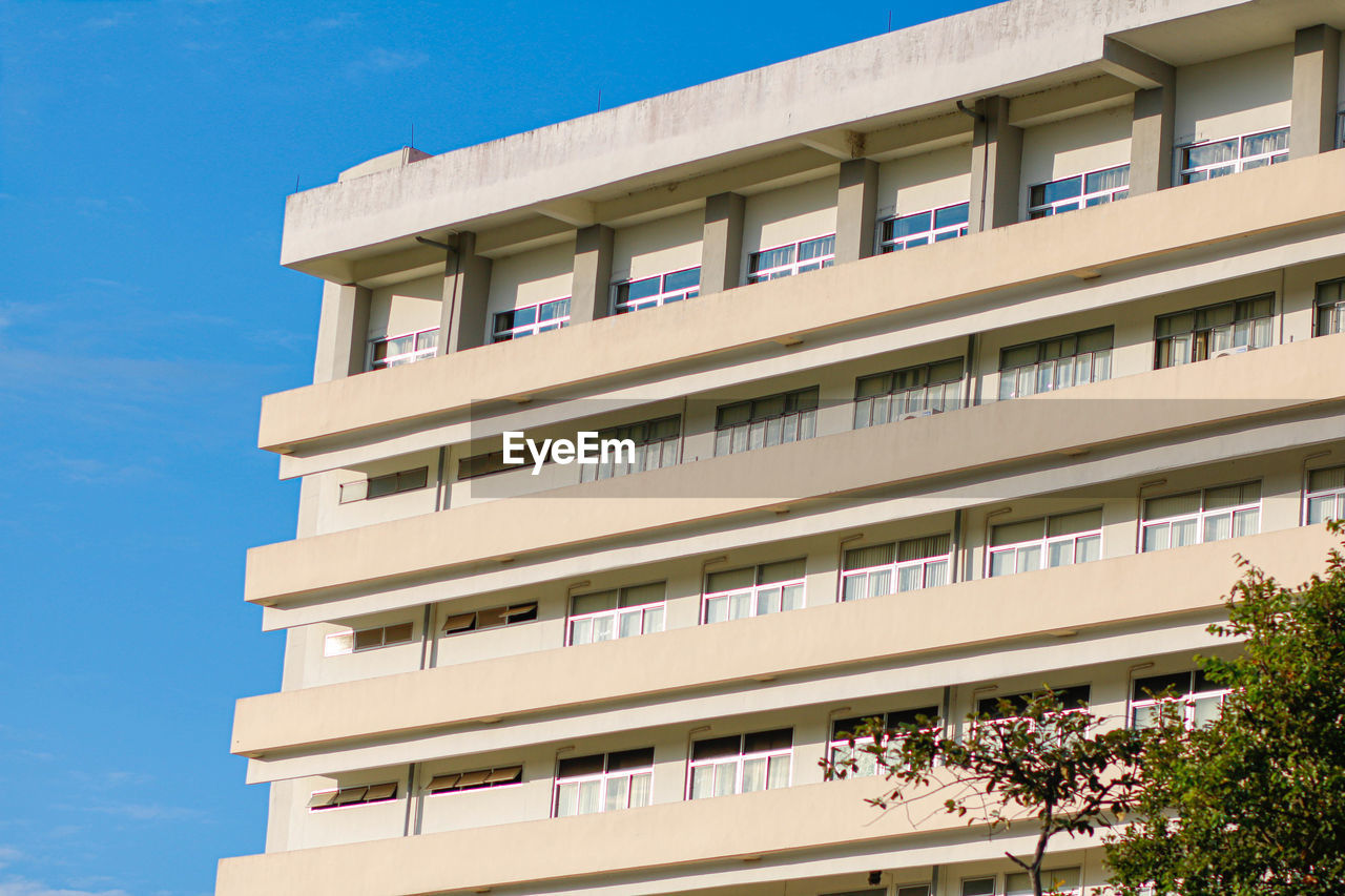 Low angle view of building against blue sky