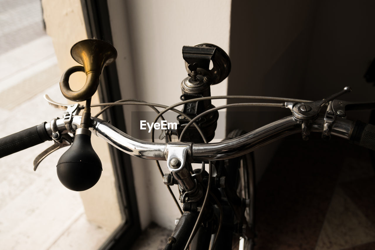 Close-up of retro styled car horn on bicycle handlebar