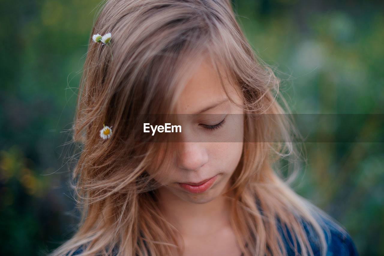 Close-up of young woman looking away