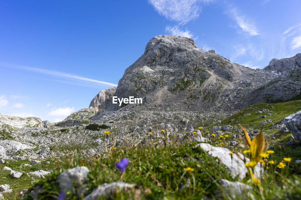 Scenic view of mountains against blue sky