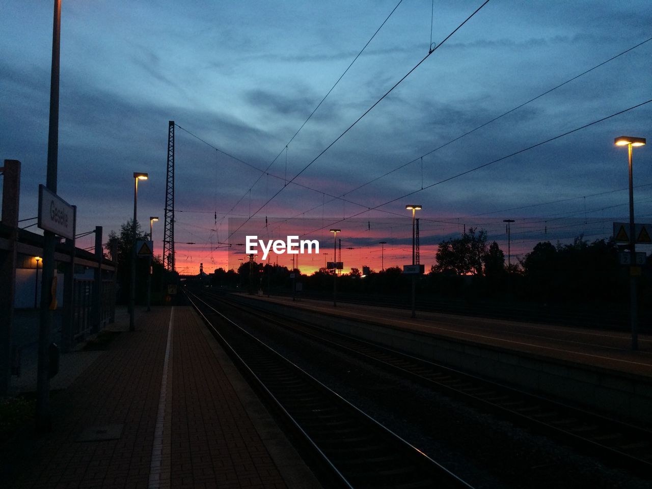 RAILROAD TRACKS AT SUNSET