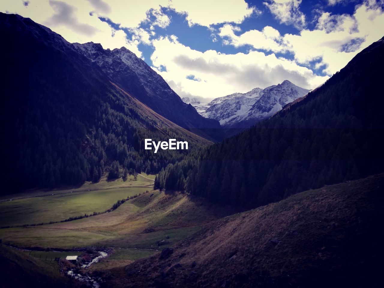 IDYLLIC SHOT OF SNOWCAPPED MOUNTAINS AGAINST SKY