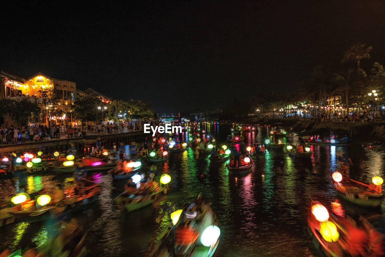 Lantern boat ride in hoi an on the thu bon river at night. taken in hoi an, vietnam