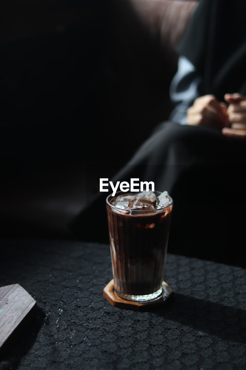 black, hand, indoors, darkness, light, one person, close-up, fashion accessory, ring, adult, jewellery, focus on foreground