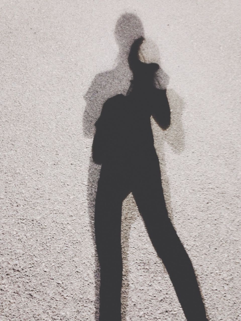 Shadow of woman on ground