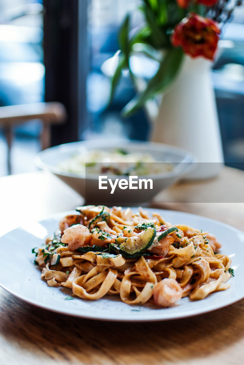 Close-up of pasta served in plate on table