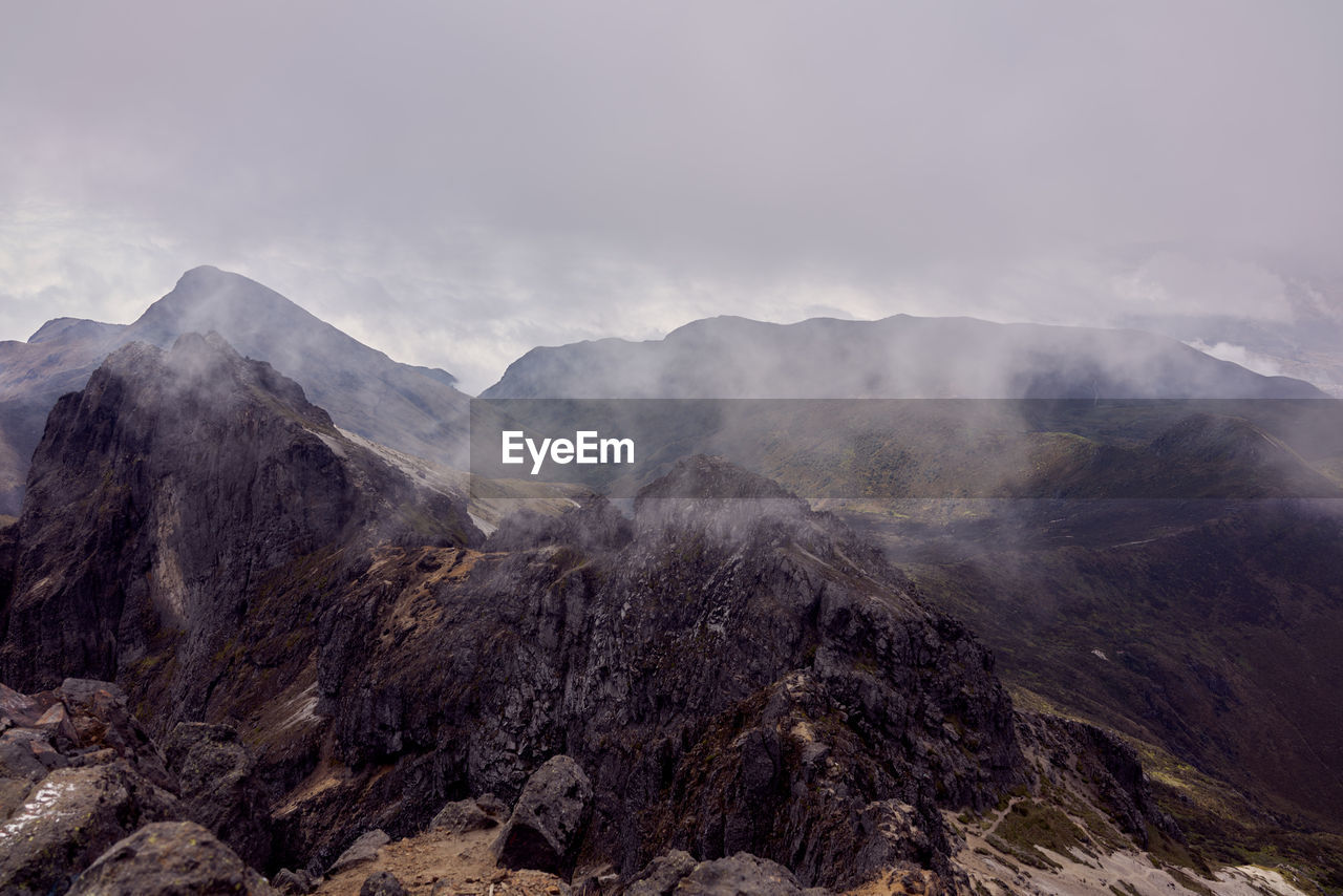 Panoramic view of volcanic mountain range against sky