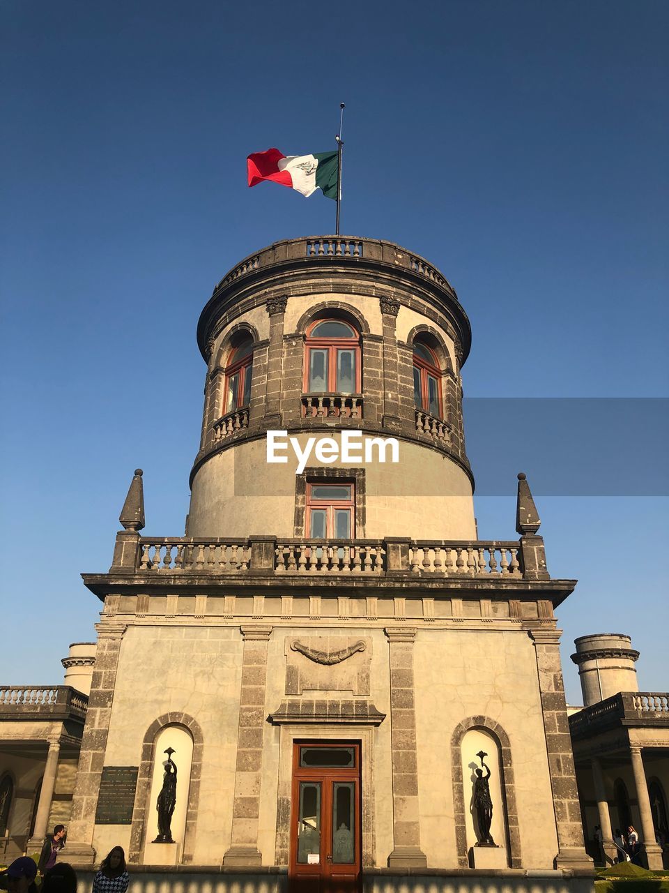 LOW ANGLE VIEW OF BUILDING AGAINST BLUE SKY