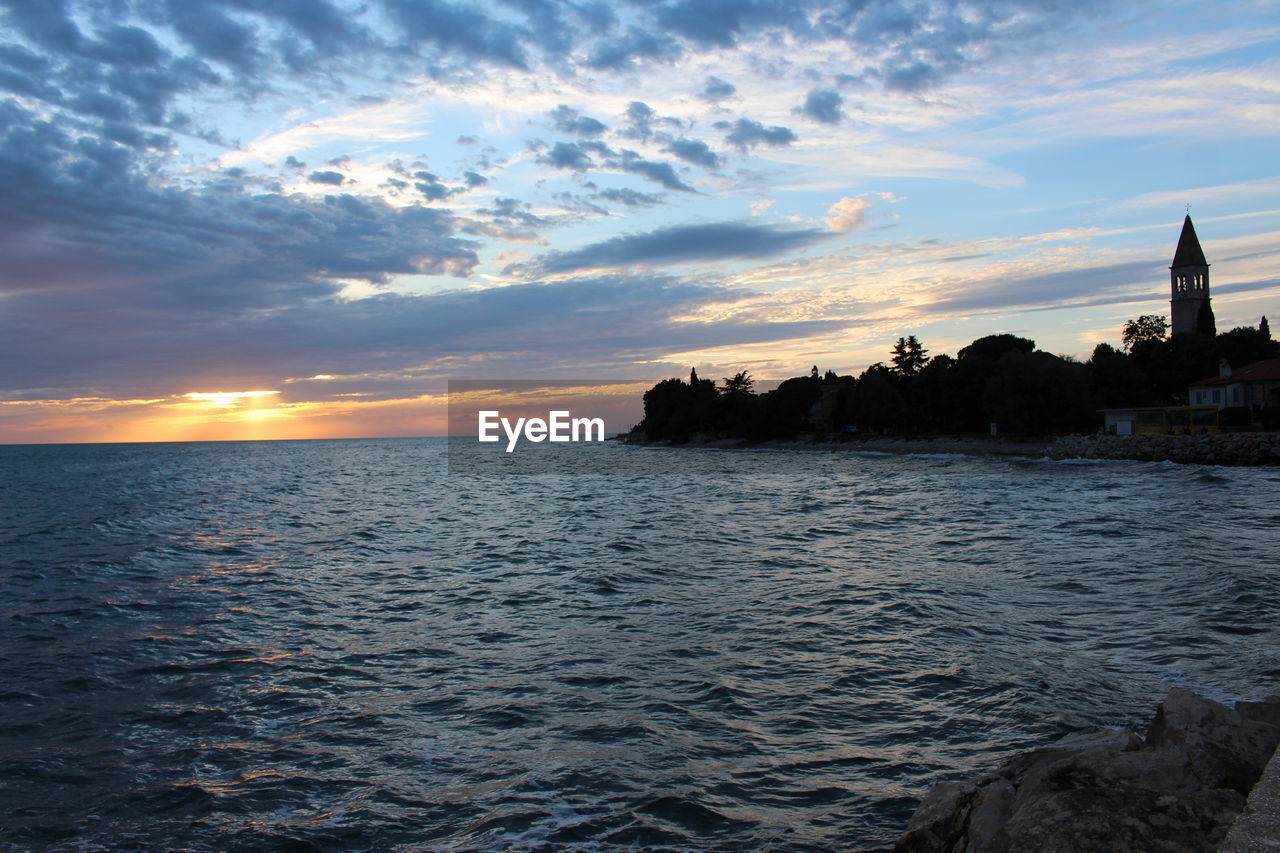 Scenic view of sea against sky at sunset