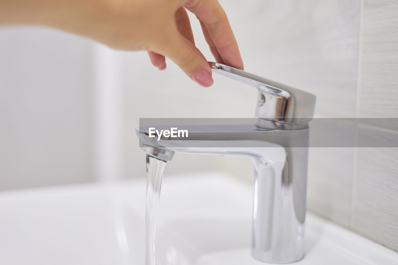 Close-up of person holding glass