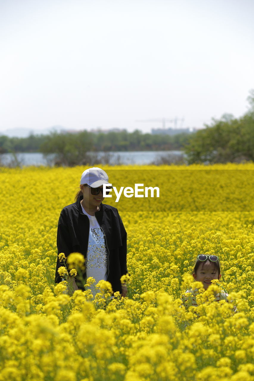 Mother and daughter in field