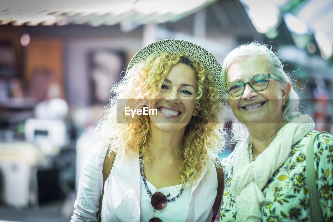 Portrait of smiling people standing outdoors