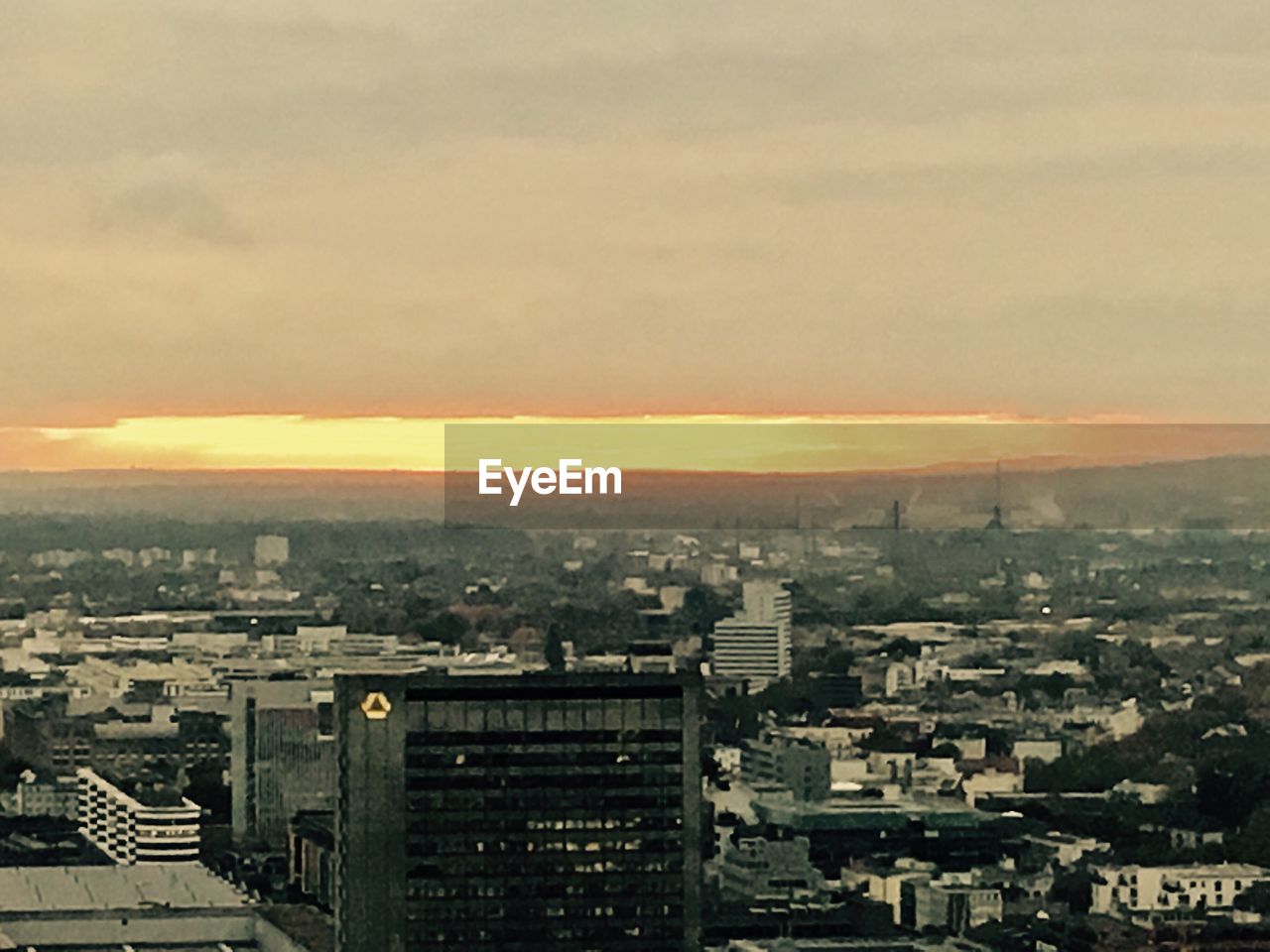 CITYSCAPE AGAINST SKY AT SUNSET