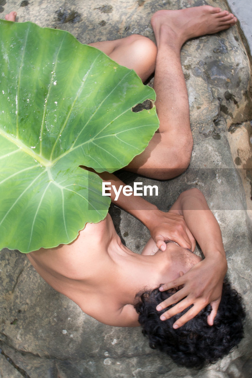 HIGH ANGLE VIEW OF WOMAN HAND WITH WATER