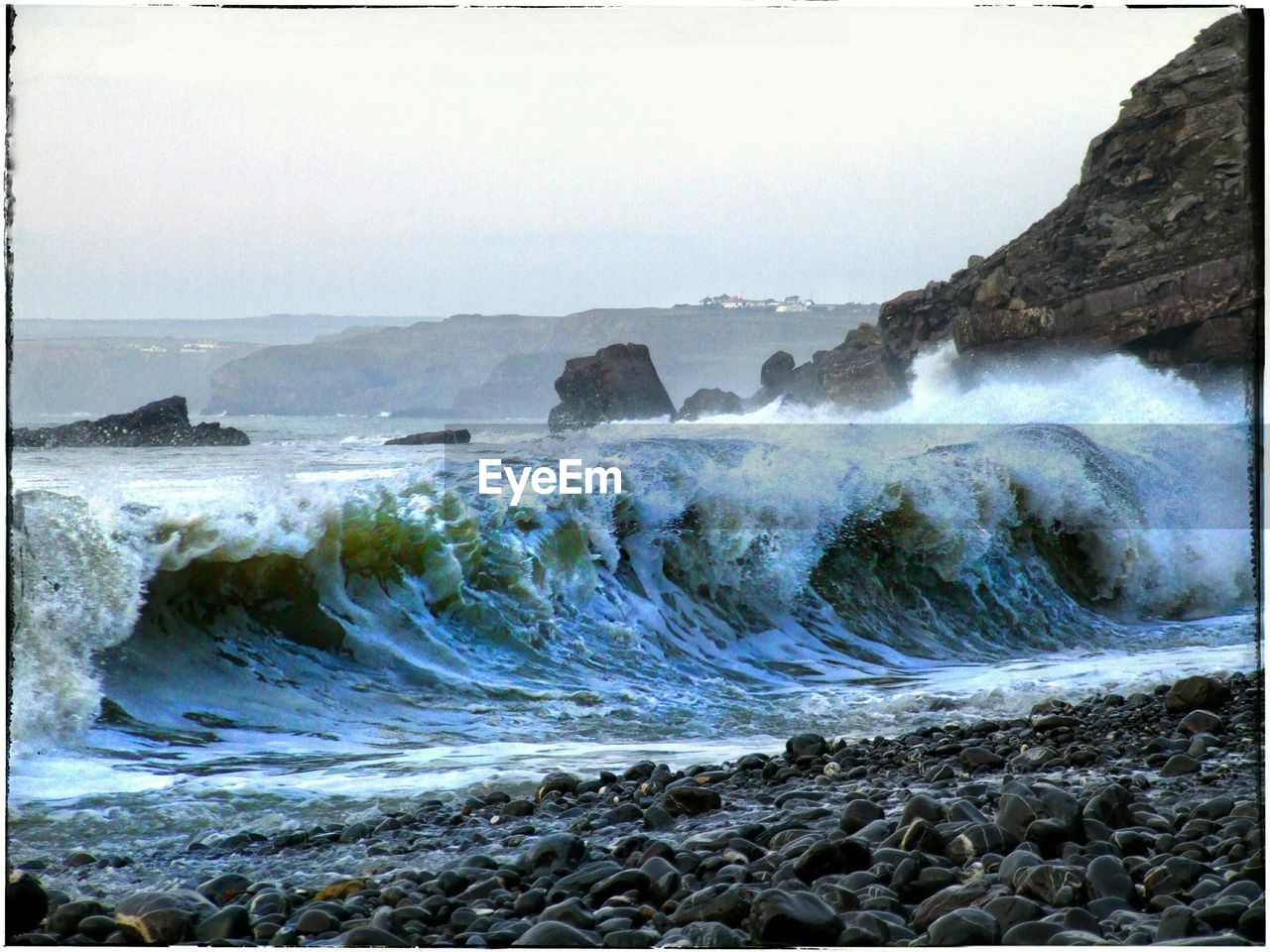 WAVES SPLASHING ON ROCKS AT BEACH