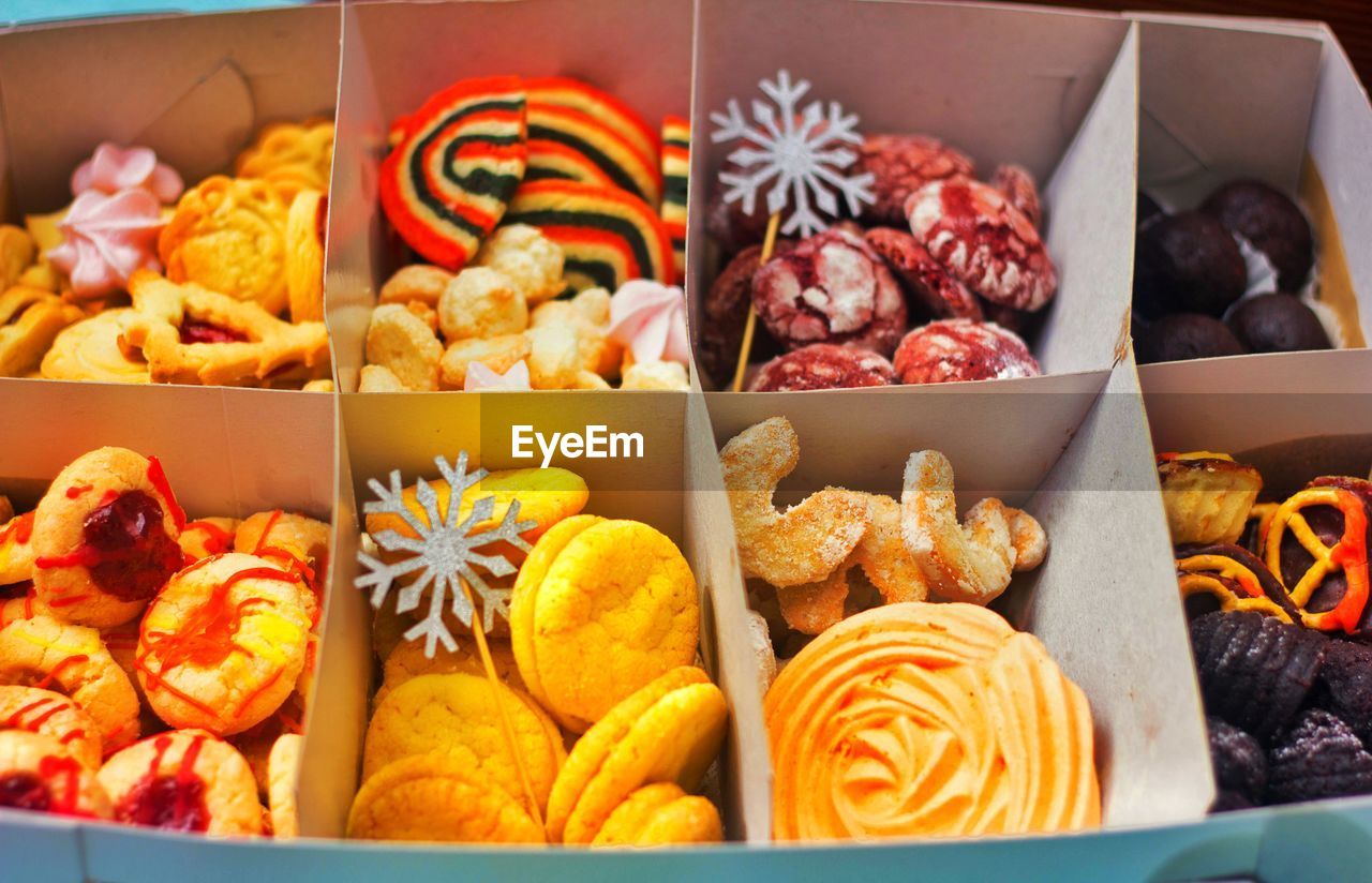 Close-up of cookies and chocolates in the christmas gift box