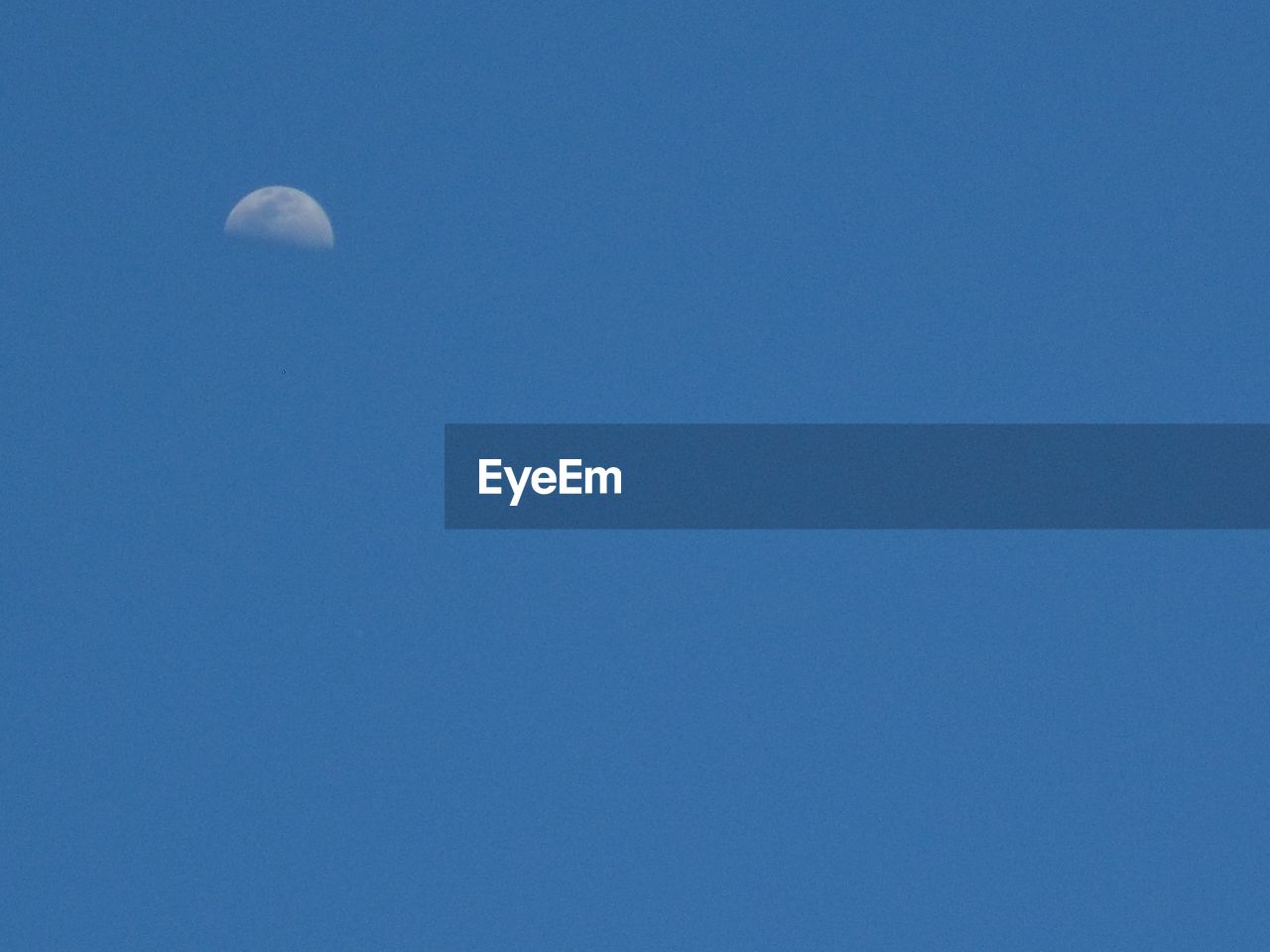 CLOSE-UP OF BLUE SKY AGAINST MOON