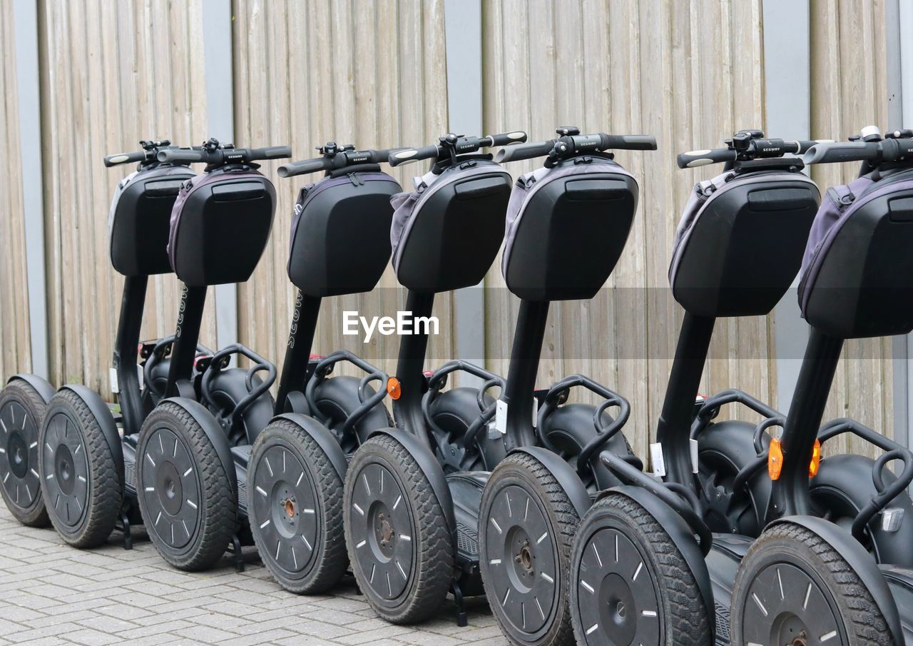 Segways parked on sidewalk