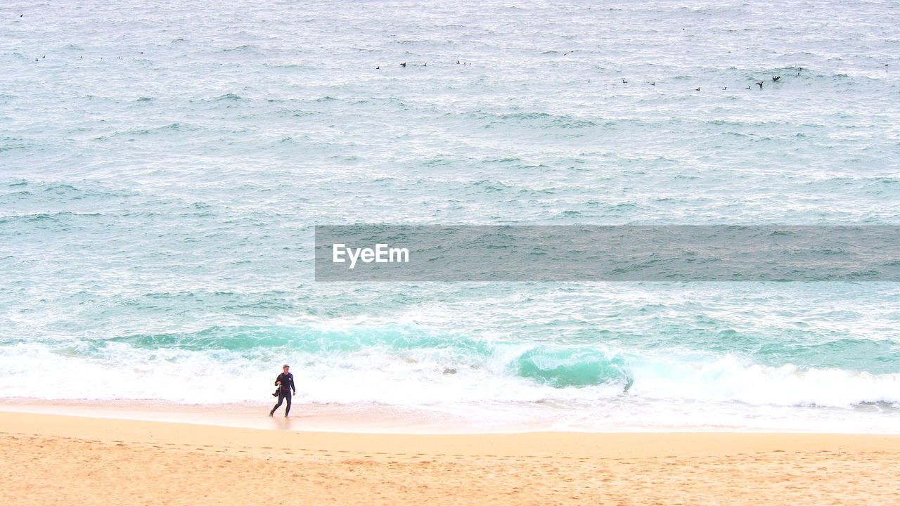 Person walking at beach